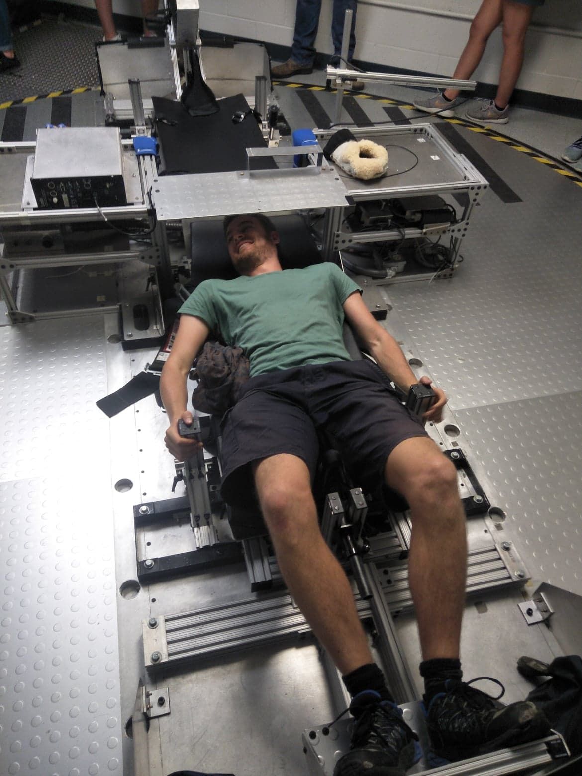 Sam Naef strapped into a space research test rig